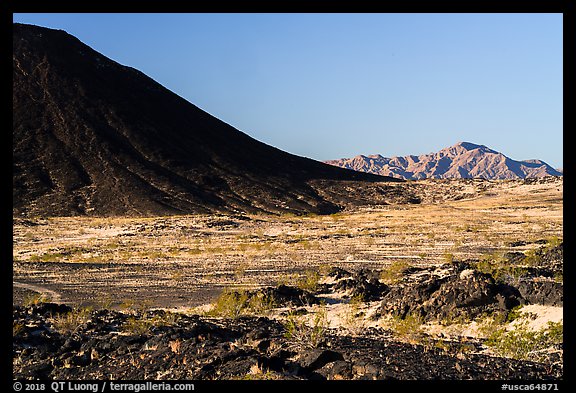 Lava field, Amboy Crater slope and mountains. Mojave Trails National Monument, California, USA (color)