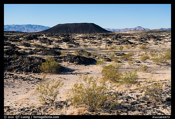 Volcanic terrain with Amboy Crater extinct cinder cone volcano. Mojave Trails National Monument, California, USA (color)