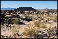 Volcanic terrain with Amboy Crater extinct cinder cone volcano. Mojave Trails National Monument, California, USA ( color)