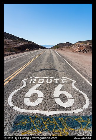 National Trails Highway (Route 66) marker and mountains. Mojave Trails National Monument, California, USA (color)