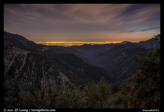 Mountains and distant Los Angeles Basin at night. San Gabriel Mountains National Monument, California, USA (color)