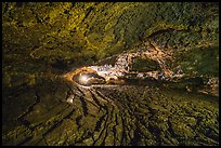 Caver in Golden Dome Cave. Lava Beds National Monument, California, USA ( color)