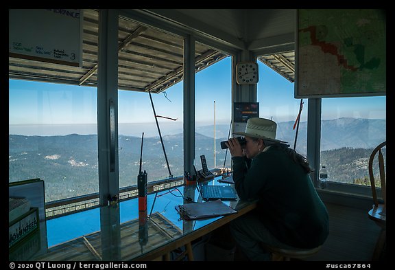 Fire lookout worker observing with binoculars. Giant Sequoia National Monument, Sequoia National Forest, California, USA (color)