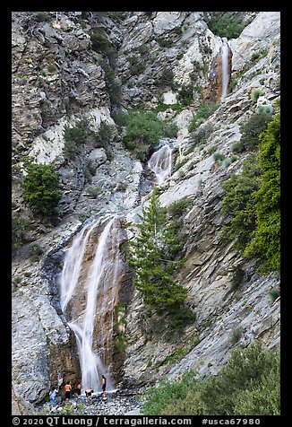 San Antonio Falls with family at the base. San Gabriel Mountains National Monument, California, USA (color)