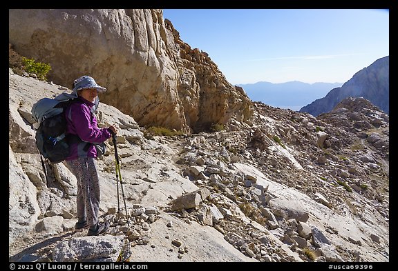 Backpacker on trail to Mt Whitney, Inyo National Forest. California (color)