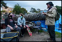 Volunteers and Peoples Park resident eating meal. Berkeley, California, USA ( color)