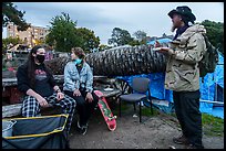 Volunteers and Peoples Park resident eating meal. Berkeley, California, USA ( color)