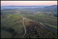 Aerial view of roads, gently rolling hills, with Salinas Valley in the distance. California, USA ( color)