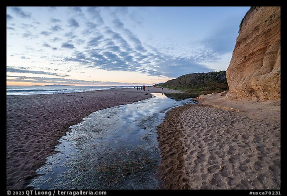 Tidal pond at sunset and visitors on beach, Santa Maria Beach. Point Reyes National Seashore, California, USA