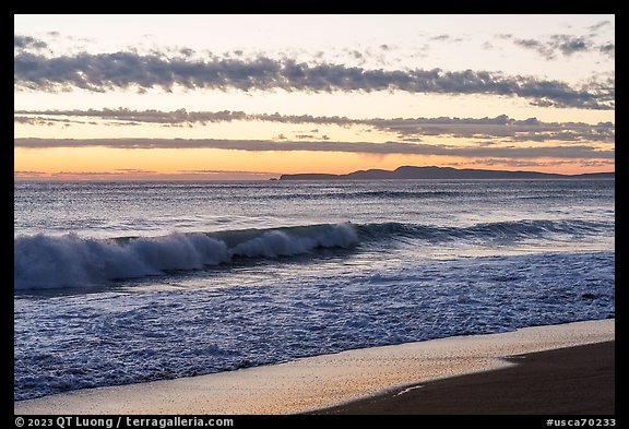 Surf and distant Point Reyes at sunset. Point Reyes National Seashore, California, USA (color)