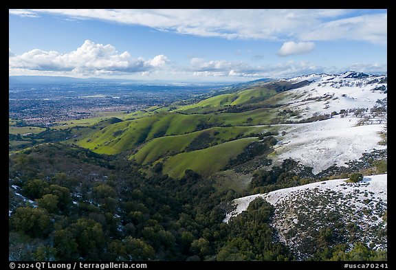 Aerial view of hills with snow overlooking Evergreen Valley. San Jose, California, USA