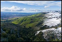 Aerial view of hills with snow overlooking Evergreen Valley. San Jose, California, USA ( color)