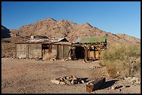 Abandoned cabin and Chuckwalla Mountains. Chuckwalla National Monument, California, USA ( color)