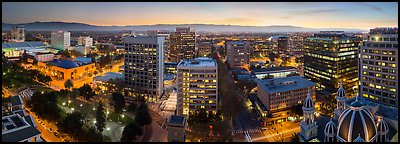 Downtown San Jose skyline and Santa Cruz Mountains at dusk. San Jose, California, USA