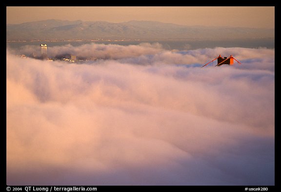 Pilar of the Golden Gate Bridge emerging from the fog at sunset. San Francisco, California, USA (color)