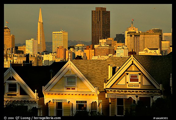 Victorians at Alamo Square and skyline, late afternoon. San Francisco, California, USA (color)