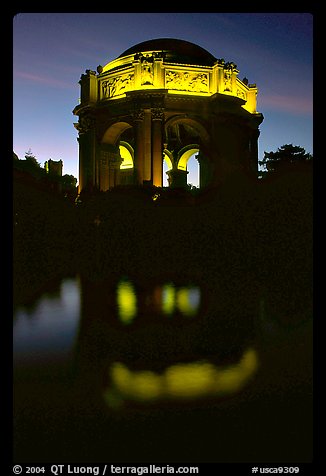 Rotunda of the Palace of Fine arts reflected in lagoon at  night. San Francisco, California, USA