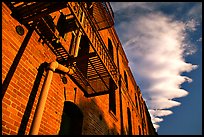 Old brick building and serrated cloud, sunset, Fisherman's Wharf. San Francisco, California, USA (color)