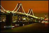 Bay Bridge seen from Treasure Island with defocused lights, sunset. San Francisco, California, USA ( color)