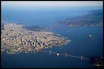 Aerial view of the Bay Bridge, the city, and  the Golden Gate Bridge. San Francisco, California, USA (color)