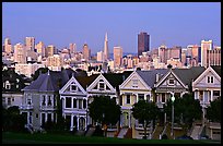 Victorians at Alamo Square and skyline, dusk. San Francisco, California, USA