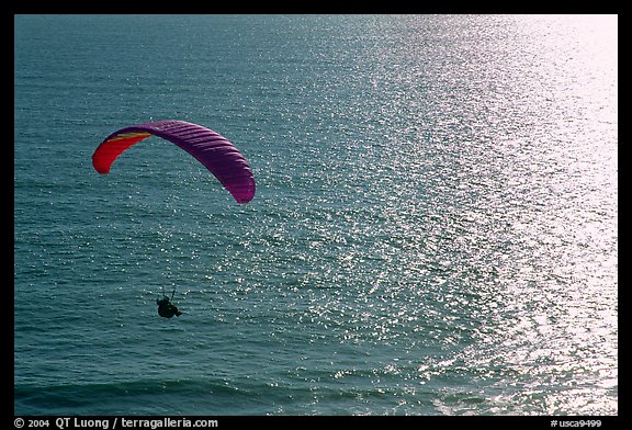 Paraglider above the ocean, the Dumps, Pacifica. San Mateo County, California, USA (color)