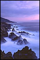 Rocks and surf near Rocky Cny Bridge, Garapata State Park, dusk. Big Sur, California, USA