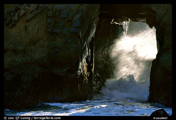 Light and wave through Arch Rock at Pfeiffer Beach. Big Sur, California, USA (color)