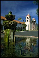Fountain and Mission Santa Babara, mid-day. Santa Barbara, California, USA (color)