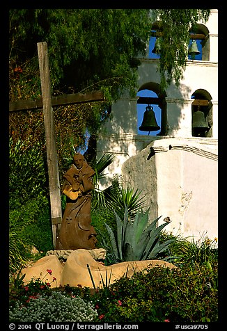 Cross, statue of father, belltower, Mission San Diego de Alcala. San Diego, California, USA