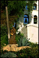 Cross, statue of father, belltower, Mission San Diego de Alcala. San Diego, California, USA