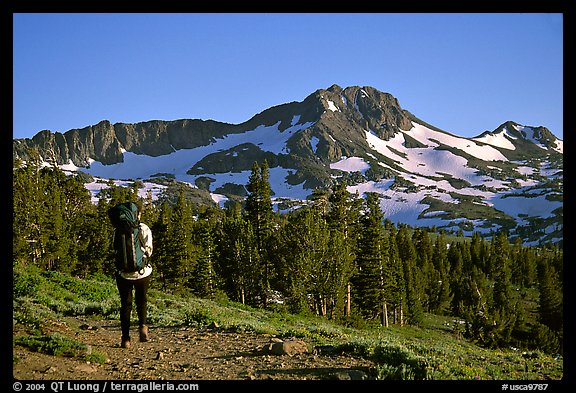 Backpacker  on trail towards Round Top. Mokelumne Wilderness, Eldorado National Forest, California, USA (color)