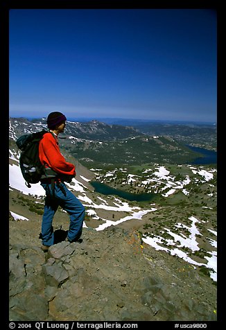 Hiker standing on top of Round Top Mountain. Mokelumne Wilderness, Eldorado National Forest, California, USA