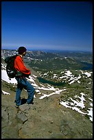 Hiker standing on top of Round Top Mountain. Mokelumne Wilderness, Eldorado National Forest, California, USA