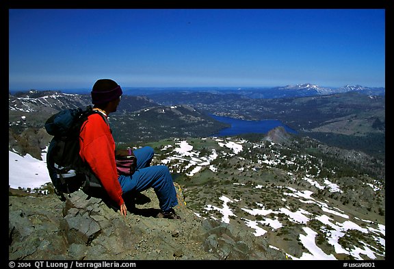 Hiker sitting  on top of Round Top Mountain. Mokelumne Wilderness, Eldorado National Forest, California, USA (color)