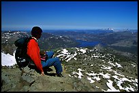 Hiker sitting  on top of Round Top Mountain. Mokelumne Wilderness, Eldorado National Forest, California, USA