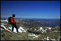 Hiker standing on top of Round Top Peak. Mokelumne Wilderness, Eldorado National Forest, California, USA ( color)