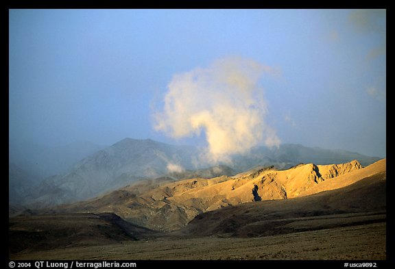 Cloud and Inyo Mountains  in stormy weather, late afternoon. California, USA (color)