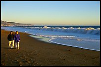 Couple strolling on the beach, late afternoon. Point Reyes National Seashore, California, USA (color)