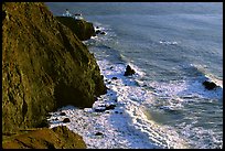 Cliffs, waves,  and Point Bonita Lighthouse, late afternoon. California, USA