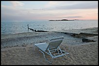 Beach chair at sunset, Westbrook. Connecticut, USA