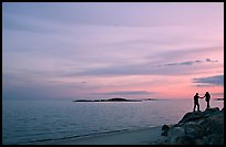 Beach with atlantic sunset and couple, Westbrook. Connecticut, USA (color)