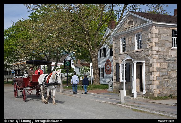 Horse carriage and bank building. Mystic, Connecticut, USA