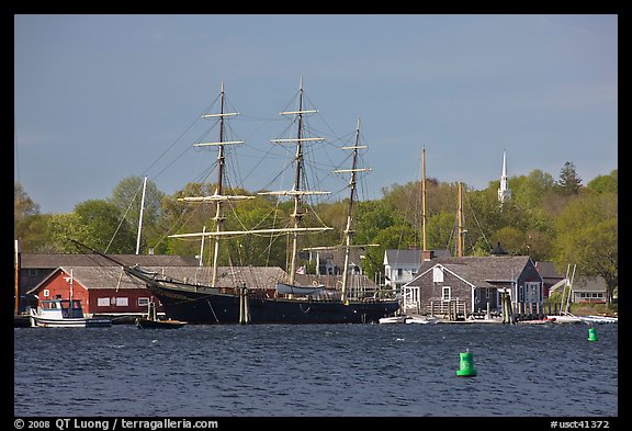 Three masted ship, Mystic River, and church. Mystic, Connecticut, USA (color)