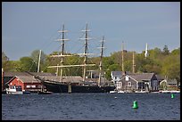 Three masted ship, Mystic River, and church. Mystic, Connecticut, USA