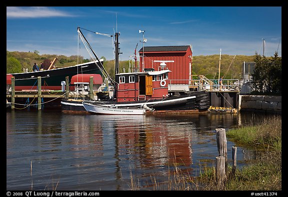 Boats and reflections at shipyard. Mystic, Connecticut, USA (color)