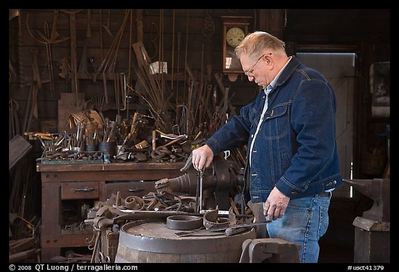 Man in ironwork shop. Mystic, Connecticut, USA (color)