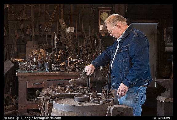 Man in ironwork shop. Mystic, Connecticut, USA