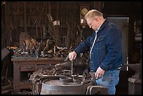 Man in ironwork shop. Mystic, Connecticut, USA (color)