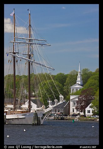 Tall ship and white steepled church. Mystic, Connecticut, USA